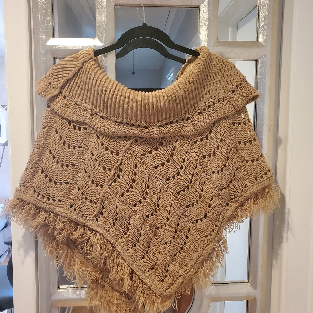 Rampage Poncho in tan. One size fits all.
